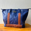 Sustainable eleather tote with light brown details from pineapple fiber leather.