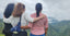 three women ovrelooking at the community mountains