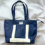 Eco-friendly upcycled blue bag with white details from pineapple leather.
