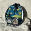 A photo of starry night painted on a crossbody bag with a horse