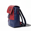 Wearsos Do Good upcycled backpack in navy blue and red with a minimalist flap design and adjustable shoulder straps.