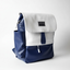 Wearsos Do Good backpack in Southwest navy blue and white, featuring a minimalist upcycled design with a fold-over flap.